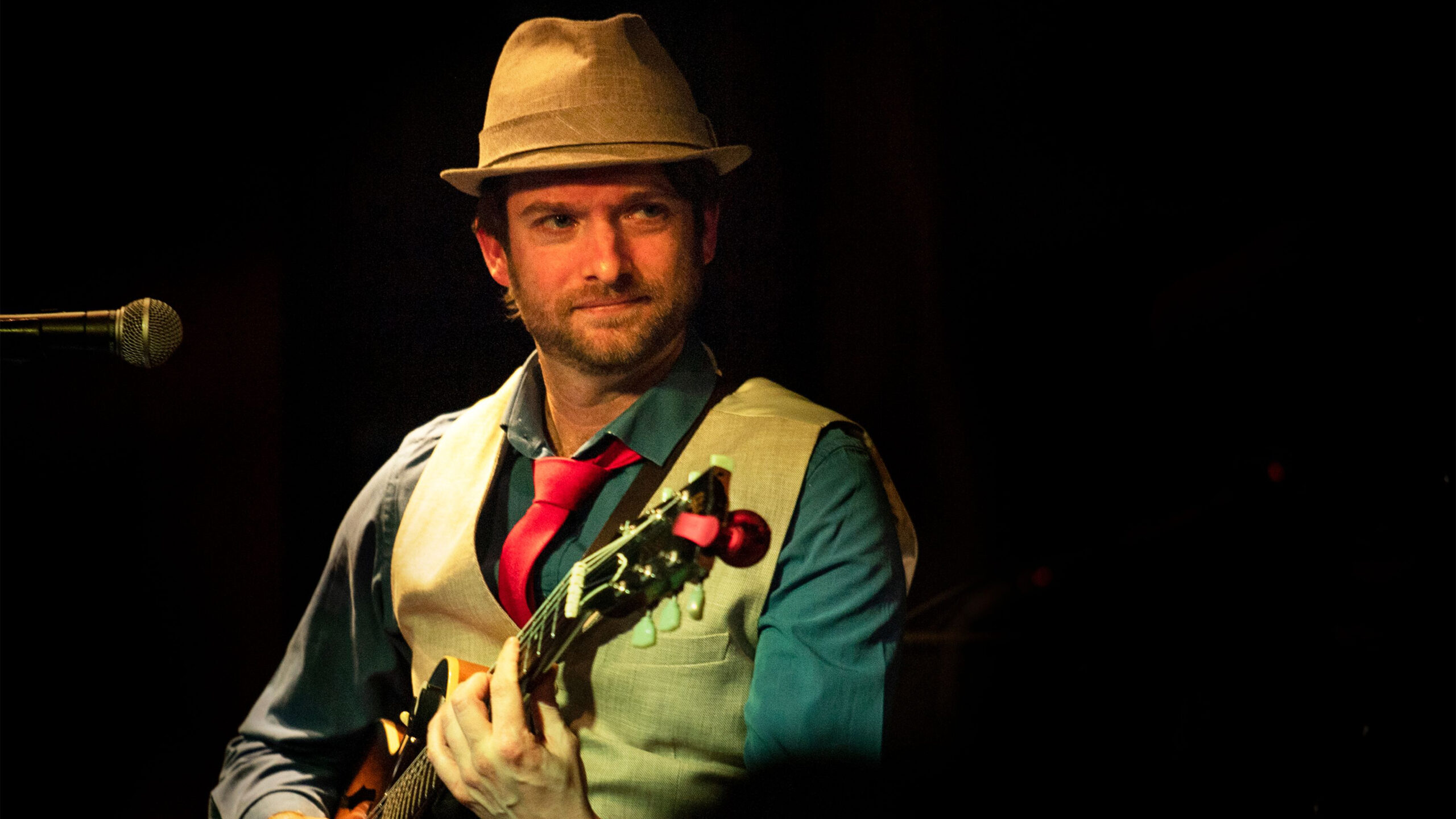 Clement Regert playing guitar