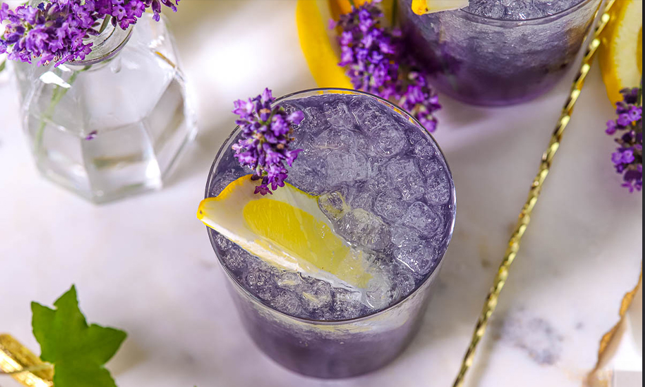purple cocktail with lavender syrup, tonic water and limoncello