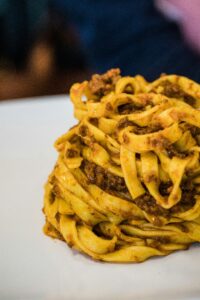Fettuccine Bolognese Della Casa – ribbon egg pasta tossed in our slow-cooked, rich beef ragù, an authentic Italian classic from Sicily Restaurant’s menu.